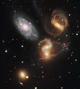 Stephan's Quintet, by NASA/ESA/Hubble SM4 ERO Team (edited by Crisco 1492)