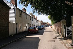 Sunny street with white clapperboard houses