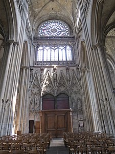 Interior wall of the north transept, with rose window