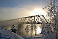 Mist rising from the Oulujoki river embraces the Vaalankurkku railway bridge in Finland, by TeVe