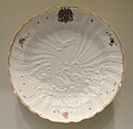 White plate, partly painted