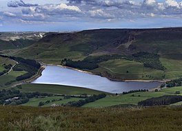 A lake deep in a valley surrounded by hills