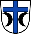 Gemeinde Bodenkirchen In Silber zwischen zwei abgekehrten schwarzen Halbmonden ein oben und unten durchgehendes blaues Kreuz.