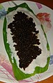 Chûn and rice paste smeared on turmeric leaf