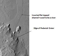 Pedestal Crater and ridge in Oxia Palus quadrangle, as seen by HiRISE. Click on image to see detail of the edge of the pedestal crater. The flat-topped ridge near the top of the image was once a river that became inverted. The pedestal crater superposes the ridge, so it is younger.