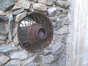 Pictured is a window that Gulley made with the spoke rim of an old car. The castle is designated as a Phoenix Point of Pride.