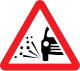 U.K.loose chippings warning sign.