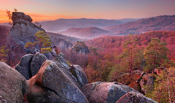 The Dovbush rocks seen at twilight, located in the Polyanytskiy Regional Landscape Park, Ukraine Photo by Пивовар Павл