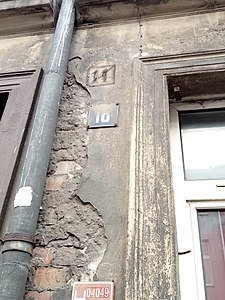 Faded ancient street number (11)