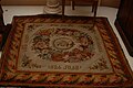 Carpet on which Elizabeth Alexeievna (Louise of Baden) stood to pray after death of Alexander I of Russia from Alexander I Palace. Now in the collection of Taganrog City Development Museum. The inscription on the carpet reads "Blessed Be the Place where You Prayed. 1826!"