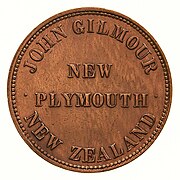The obverse of a copper penny token, featuring the text "NEW PLYMOUTH", arcing above "JOHN GILMOUR" and below "NEW ZEALAND"