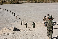 Afghan National Army (ANA) patrolling alongside U.S. Marines in Musa Qala (2010)