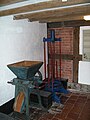 Curd mill and cheese press in the dairy display.