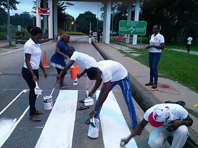 KNUST students repainting the zebra crossings in their school, Kumasi