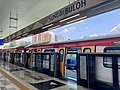 Train of MRT Putrajaya Line opening in the station platform.