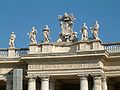 There are many statues on the colonnade and roof.