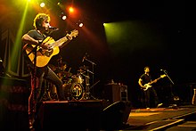 The John Butler Trio (left to right: John Butler on guitar, Nicky Bomba on drums, Byron Luiters on bass) performing in Toronto c. 2012