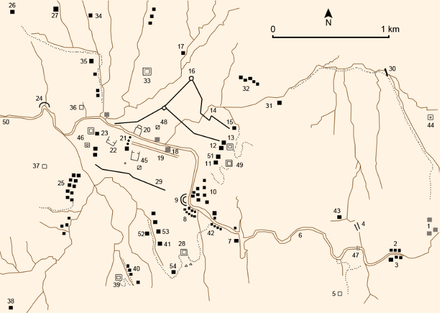 plan avec des tracés de routes, de rivières et de monuments représenté par de petits carrés