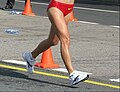 Image 8A racewalker "flying" (entirely out of contact with the ground, a rule violation) (from Racewalking)