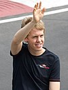 Sebastian Vettel waving to a group of spectators at the 2008 Canadian Grand Prix