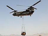 Australian CH-47 lifting a front loader in Afghanistan