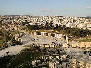 The Greco-Roman city of Gerasa and the modern Jerash in the background.