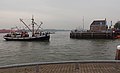 The national arrival of Sinterklaas in Maassluis, ship for marine salvage (de Bruinvisch) with Zwarte Pieten