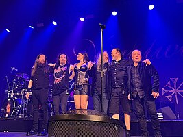 Nightwish after a performance in Toronto in May 2022; (L–R): Jukka Koskinen, Tuomas Holopainen, Floor Jansen, Troy Donockley, Kai Hahto, Emppu Vuorinen