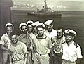 Image 54Australian sailors with a Bathurst-class corvette in the background. The RAN commissioned 56 of this class of corvettes during World War II. (from History of the Royal Australian Navy)
