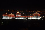 Photo of illuminated Tashichödzong at night taken from Lanjopakha