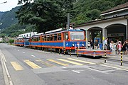 Monte Generoso trains at their stop in front of the station