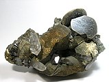 Disc-shaped, brown siderite crystals perched upon chalcopyrites.