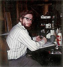 David McDaniel at his desk, writing, 1974.