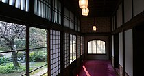 A wide photograph of a hallway from the Takahashi Korekiyo residence in the Edo-Tokyo Open Air Architectural Museum, which was one of Miyazaki's inspirations in creating the spirit world's buildings.
