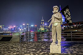 A person cosplaying as the Lady Liberty Hong Kong in Tsim Sha Tsui, October 2019