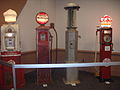 Four old-fashioned gasoline pumps at the 2012 Greater Milwaukee Auto Show.