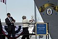 Ship sponsor Dotty England smashes the traditional bottle of champagne on New York's hull during the christening ceremony on 1 March 2008