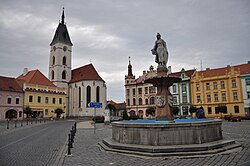 Svobody Square with the church and Baroque fountain