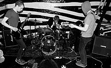 Adebisi Shank in 2009 (from left to right; Lar Kaye, Michael Roe, Vincent McCreith).