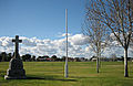 Eric Sutton Oval at Rosewater, South Australia. Seen in the foreground is a small WWI memorial and a flag pole.