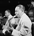 Johnny Hodges (foreground) and Al Sears, Aquarium, New York. Hodges is playing a Conn 6M alto saxophone.