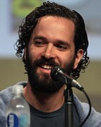 Neil Druckmann talks into a microphone