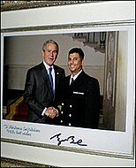 President George W. Bush congratulates Navy Chaplain, Imam Abuhena Saifulislam, the first U.S. Navy Muslim chaplain assigned to the Marine Corps