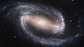 Image 20NGC 1300 is a barred spiral galaxy located roughly 69 million light-years away in the direction of the constellation Eridanus. In its core, the nucleus shows its own extraordinary and distinct "grand-design" spiral structure that is about 3,300 light-years long.