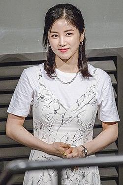 Park in white dress and smiling for the camera in July 2020