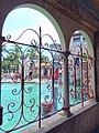 View of pool through entrance building