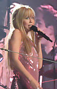 Miley Cyrus on tour in the title role