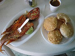 Red snapper (chillo) and domplines (Puerto Rican arepas) at a seafood restaurant in the malecón.