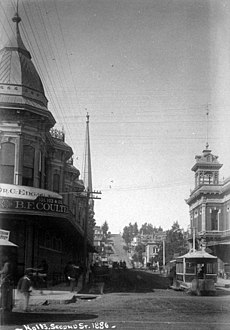View west on 2nd at Spring. Hollenbeck Block (left) when it was only two stories, note Coulter's store; 2nd City Hall (right), 1886