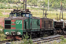 OPE1A electro-diesel locomotive with primary electric locomotive (A unit), diesel-generator booster (B unit) and motorized dump car